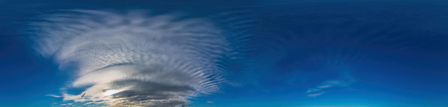 Blue sky with Cirrus clouds Seamless panorama in spherical equirectangular format. Complete zenith for use in 3D graphics, game and for composites in aerial drone 360 degree panoramas as a sky dome photo