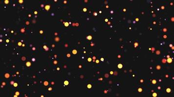 Abstract animation concept of golden particles for celebrating birthdays and holidays. 4k loop bokeh background with light particles on a dark background. Animation footage with light leakage effect. video