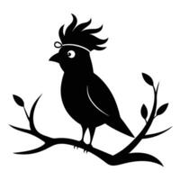 A black bird sitting on a branch with leaves vector