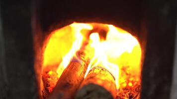 Cozy Warmth Glow of Flames Dancing Around Logs in Fireplace, Creating Inviting Atmosphere of Comfort and Vibrant Orange Hues video