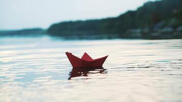 Paper boat floating on water video