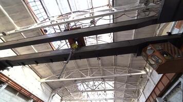 Factory overhead crane inside factory building. Industrial factory view. video