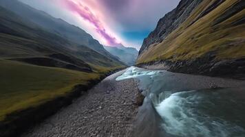 Animation A verdant valley where a crystal clear river carves its way through towering mountains creates a stunning view of the raw beauty and power of nature. video
