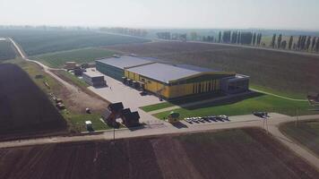 Aerial over fruit orchard farm showing different buildings to warehouse apples and pears also in background showing trees that grow the fresh fruit important food production site healthy food 4k video