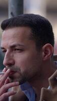 A contemplative man is situated in an urban environment, lost in deep thought and reflection video