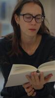 A Woman Deep in Thought While Reading a Book, Perfectly Capturing a Moment of Reflection and Calm video