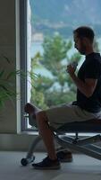 A man is actively exercising with dumbbells in a modern and wellequipped gym setting video
