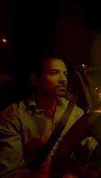 Embarking on a nighttime drive with a focused and attentive driver, navigating the city streets video