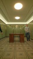 An Elegant Vault Interior featuring Green Lockers along with a Central Table for functionality video