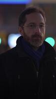A Candid Urban Portrait of a Thoughtful Man in the Night with a Captivating Atmosphere video