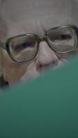 A Focused Expression of an Older Gentleman with Glasses Capturing His Intense Thoughts video