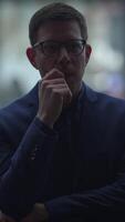 A contemplative professional found in an urban setting, exhibiting deep thought and focus video