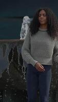 A Contemplative Woman in an Urban Setting by a Serene Water Feature, Exuding Calmness and Grace video
