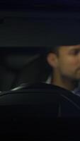 A CloseUp of a Driver Focused in a Car Cabin during the Nighttime, showcasing various elements video