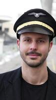 A Professional Airline Pilot dressed in their Uniform, ready to take on the skies and fly video