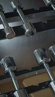 Here is a CloseUp Image of Dumbbells Arrangement on Rack in a Fitness Gym Environment video