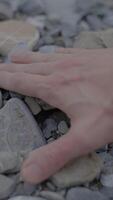 A Hand Resting Gently on Pebbles A Representation of Nature and Deep Tranquility video