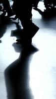 Silhouettes cast upon a reflective surface, showcasing dynamic movement and artistry video