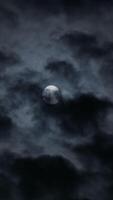 A Mysterious Moonlight Gently Illuminating the Dark Clouds in the Expansive Night Sky Above video