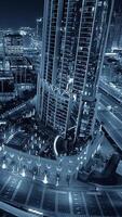 The gorgeous and stunning night view of a towering skyscraper located in a modern city environment video