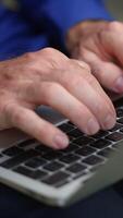 A CloseUp of Hands Engaged in Typing on a Laptop Keyboard, Highlighting Focus and Precision video