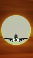 An Airplane is Landing Against the Backdrop of a Beautiful Sunset, Creating a Stunning View video