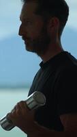 A fit Athletic Man in Profile at a Beautiful Scenic Location That Inspires Activity and Ambition video