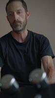A Man Engaged in Thoughtful Reflection Within a Minimalist and Serene Setting Environment video