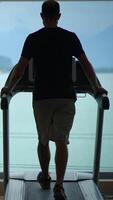 A Man Actively Engaging in Exercise on a Treadmill While Enjoying a Scenic View Around Him video