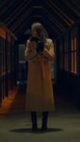 A Mysterious Figure Stands in a Dimly Lit Corridor During the Late Evening Hours video