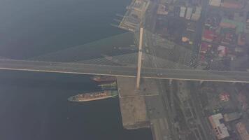 Drone view of the Golden Bridge and the city at dawn in heavy smog video