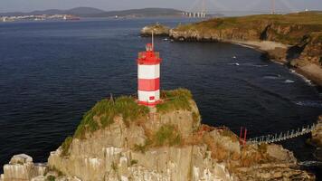 Drone view of the picturesque old Basargin lighthouse on the coast of the sea video