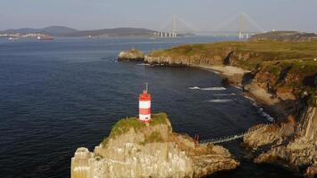 Drone view of the picturesque old Basargin lighthouse on the coast of the sea video