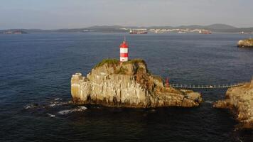 Drone view of the picturesque old Basargin lighthouse on the coast of the sea video