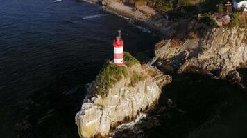 Drone view of the picturesque old Basargin lighthouse on the coast of the sea video