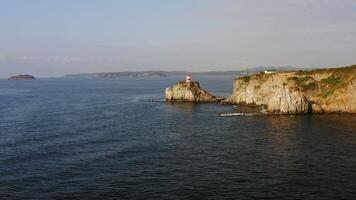 Drone view of the picturesque old Basargin lighthouse on the coast of the sea video