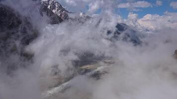 Aerial. mountain scenery with swirling clouds and a huge glacier video