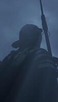 A mysterious silhouette of a soldier stands out dramatically beneath a backdrop of cloudy skies video