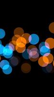 A beautiful Bokeh background featuring blue and orange circular lights creating an aesthetic effect video