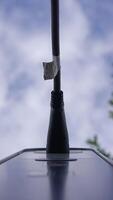 An antenna set against a background of a cloudy sky, emphasizing its communication technology video