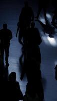 Silhouetted Figures in Dynamic Motion Against a Background of Urban Life and Energy video