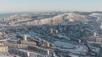 Winter view from a drone of a city with hills at sunrise video
