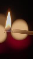 A Candle Flame That Illuminates a Dark Background, Creating a Warm and Inviting Atmosphere video