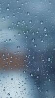 Raindrops are gently falling on the window, creating a beautiful image with a blurred background video