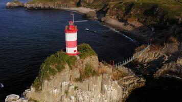 Drone view of the picturesque old Basargin lighthouse on the coast of the sea video