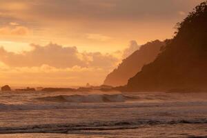 View of a sunset on the seashore on a Costa Rican beach photo