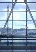 Vertical indoor of terminal building with big windows and lateral elevator photo