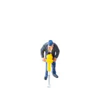 Miniature construction worker isolate on white background with clipping path photo
