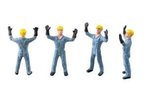 Miniature construction worker isolate on white background with clipping path photo