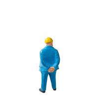 Miniature construction worker isolate on white background with clipping path photo